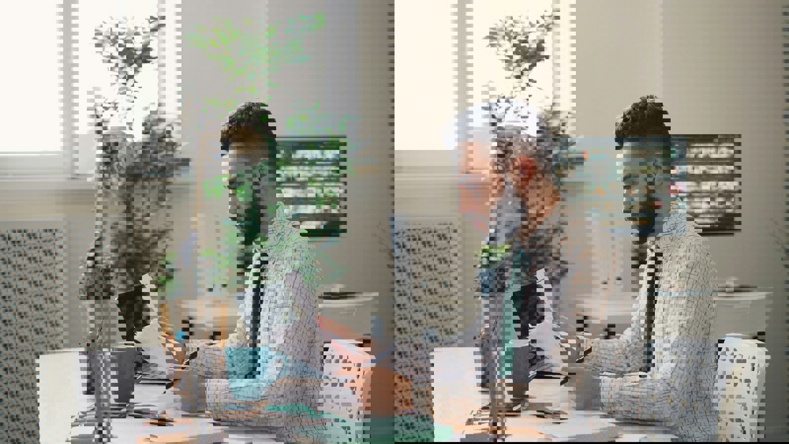 A man sat working at a desk